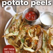 Text overlay: Air fryer potato peels, don't throw those peels away, get the recipe at cadryskitchen.com. Platter with air fried potato peels and sauces for dipping.