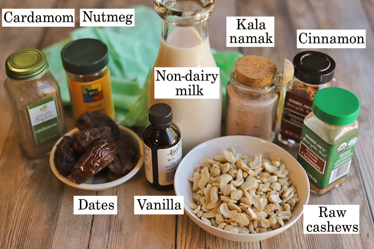Labeled ingredients for vegan eggnog with cashews and dates.