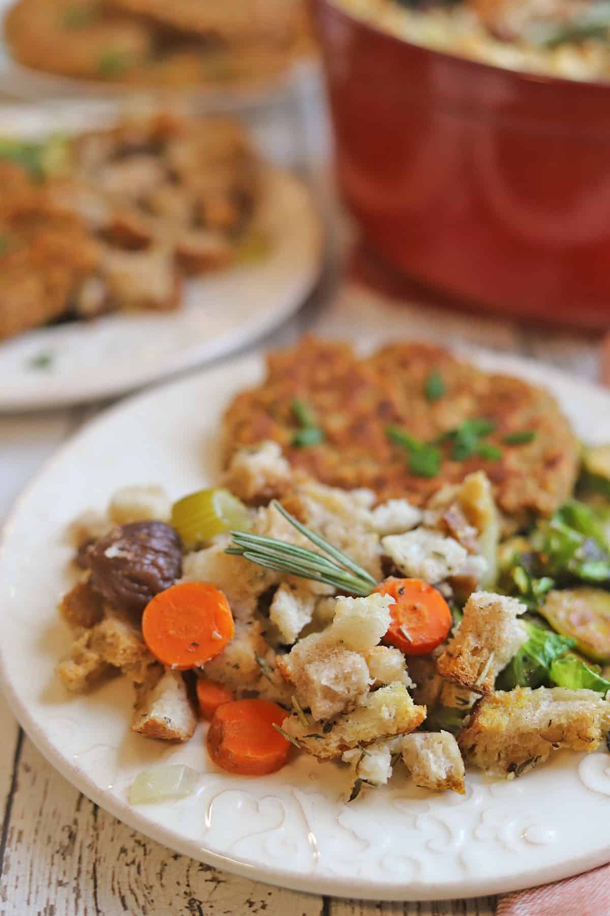 Meatless stuffing on plate with schnitzel and Brussels sprouts.