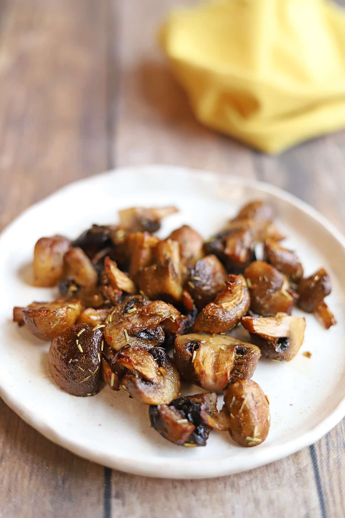 Browned cremini mushrooms with rosemary, thyme, and garlic.
