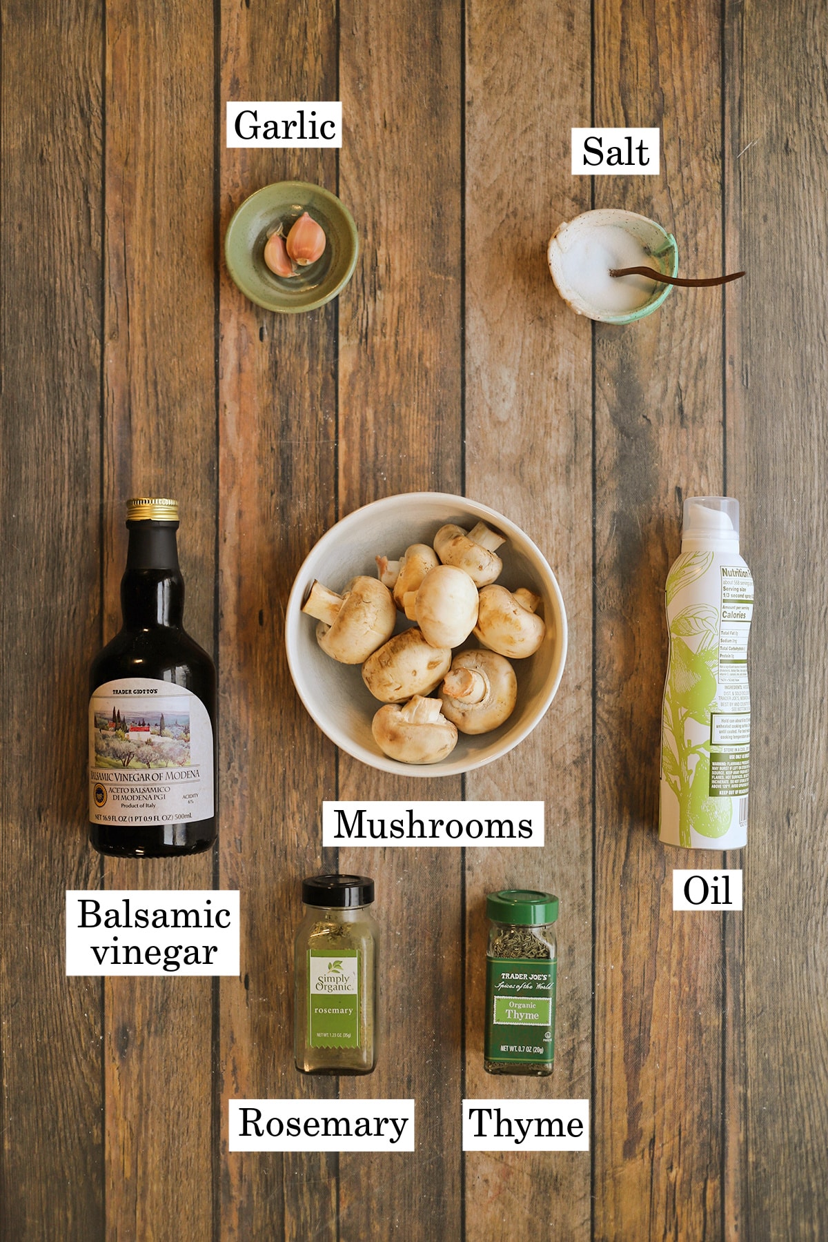 Labeled ingredients for air fryer mushrooms recipe: garlic, salt, balsamic vinegar, mushrooms, oil, rosemary, and thyme.