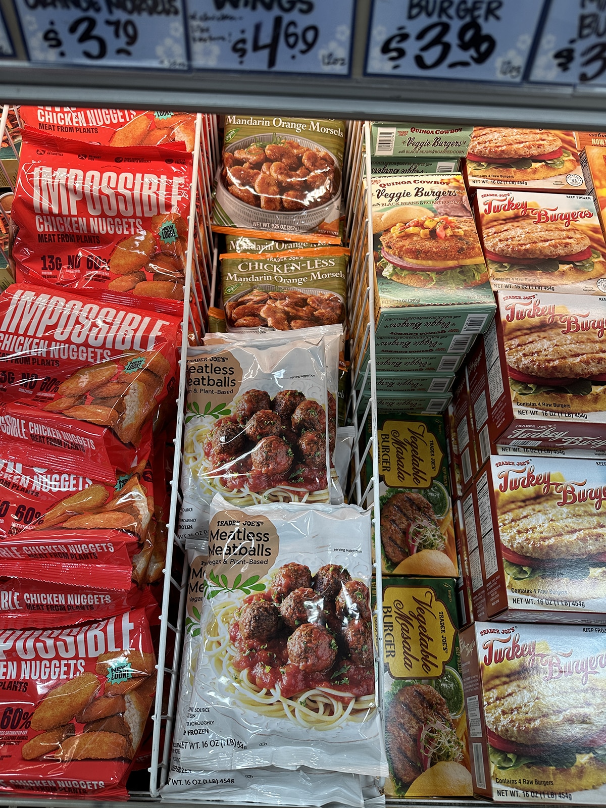 Trader Joe's meatless meatballs in freezer case with vegetable masala burgers and Impossible chicken nuggets.