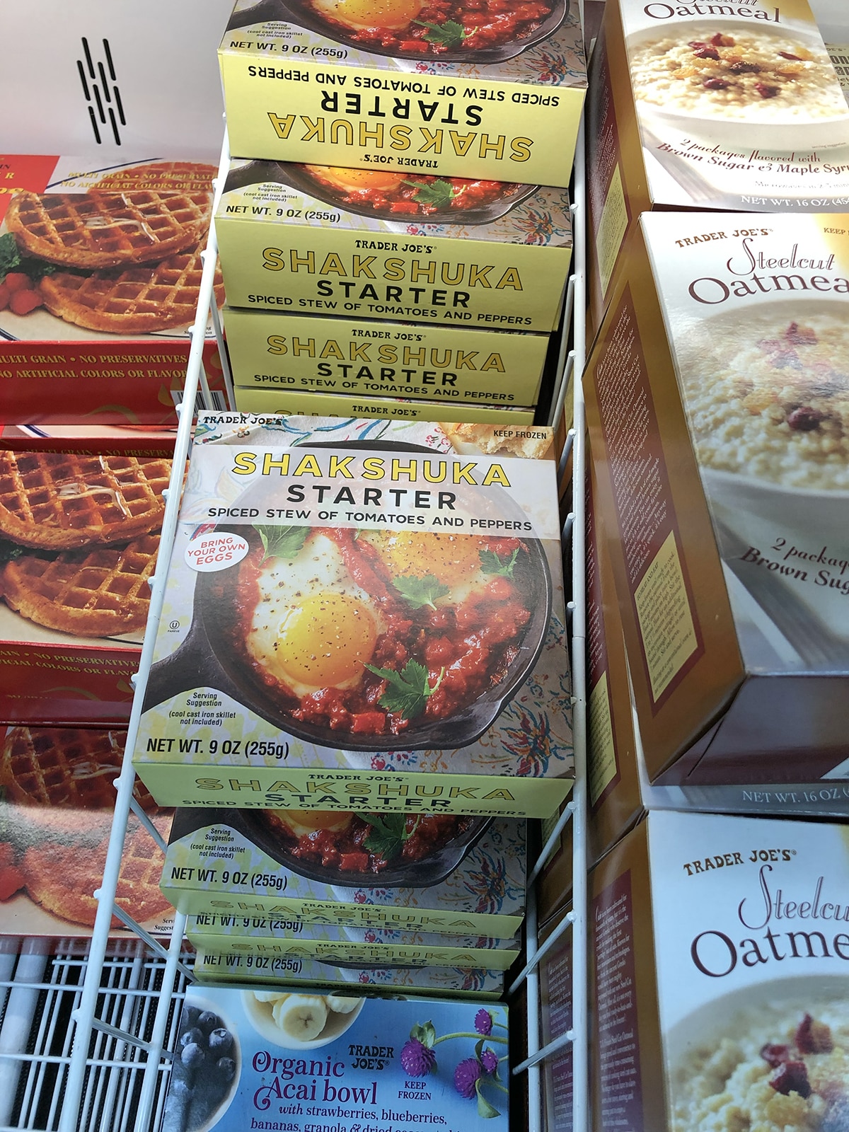 Packages of shakshuka starer at Trader Joe's in freezer case.