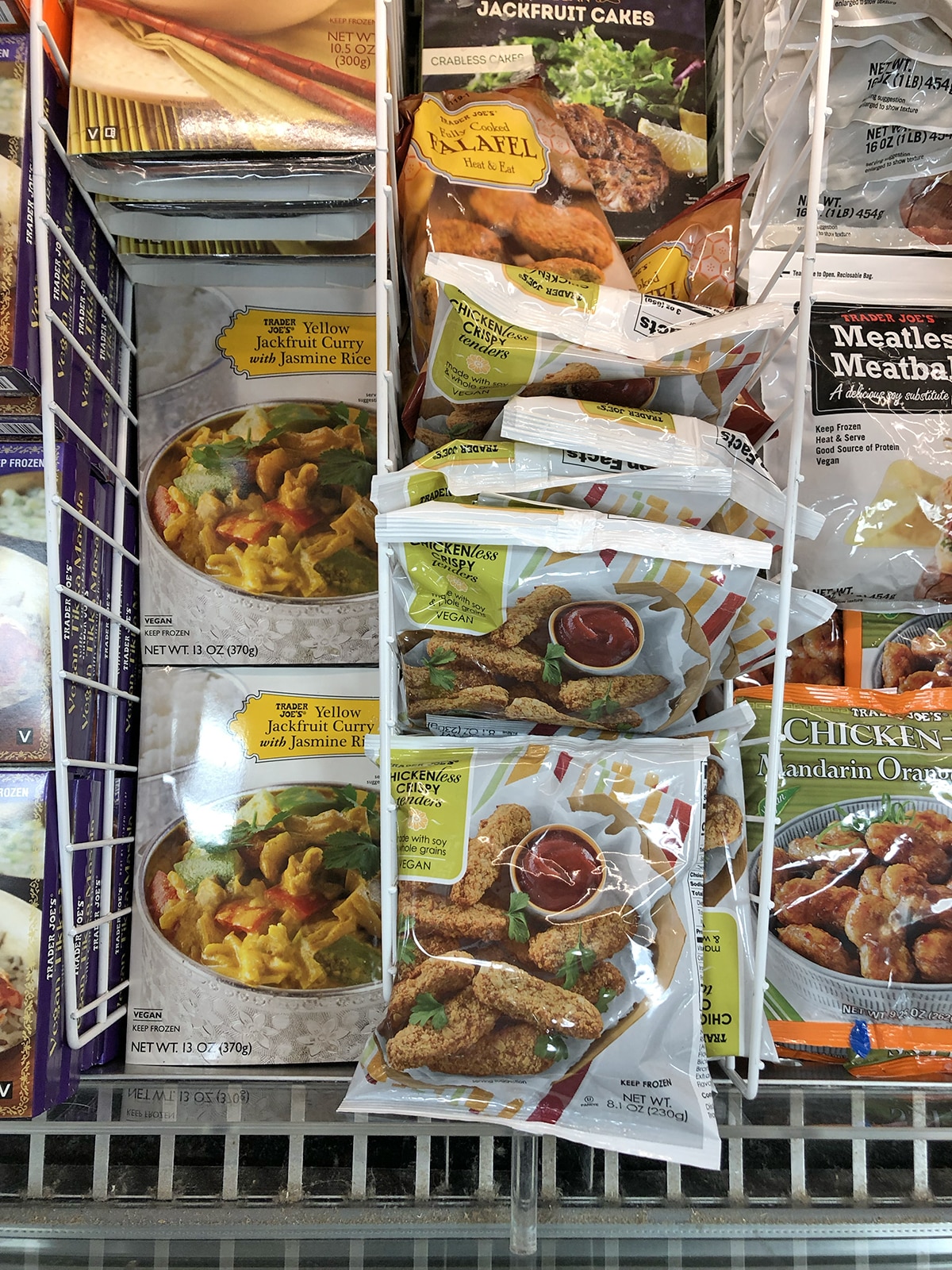 Yellow jackfruit curry and chicknless crispy tenders in frozen case at Trader Joe's.