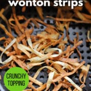 Text overlay: Crispy air fryer wonton strips, crunchy topping, cadryskitchen.com. Crispy wonton strips in air fryer basket.