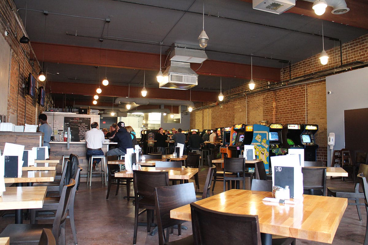 Tables, bar, and arcade at Quarter Barrel in Cedar Rapids, Iowa.