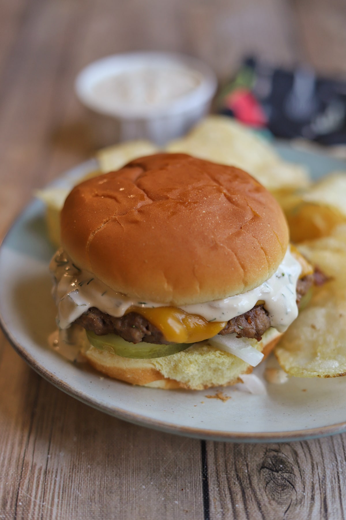 Impossible burger topped with Trader Joe's cashew cheddar cheese and dill pickle dip.