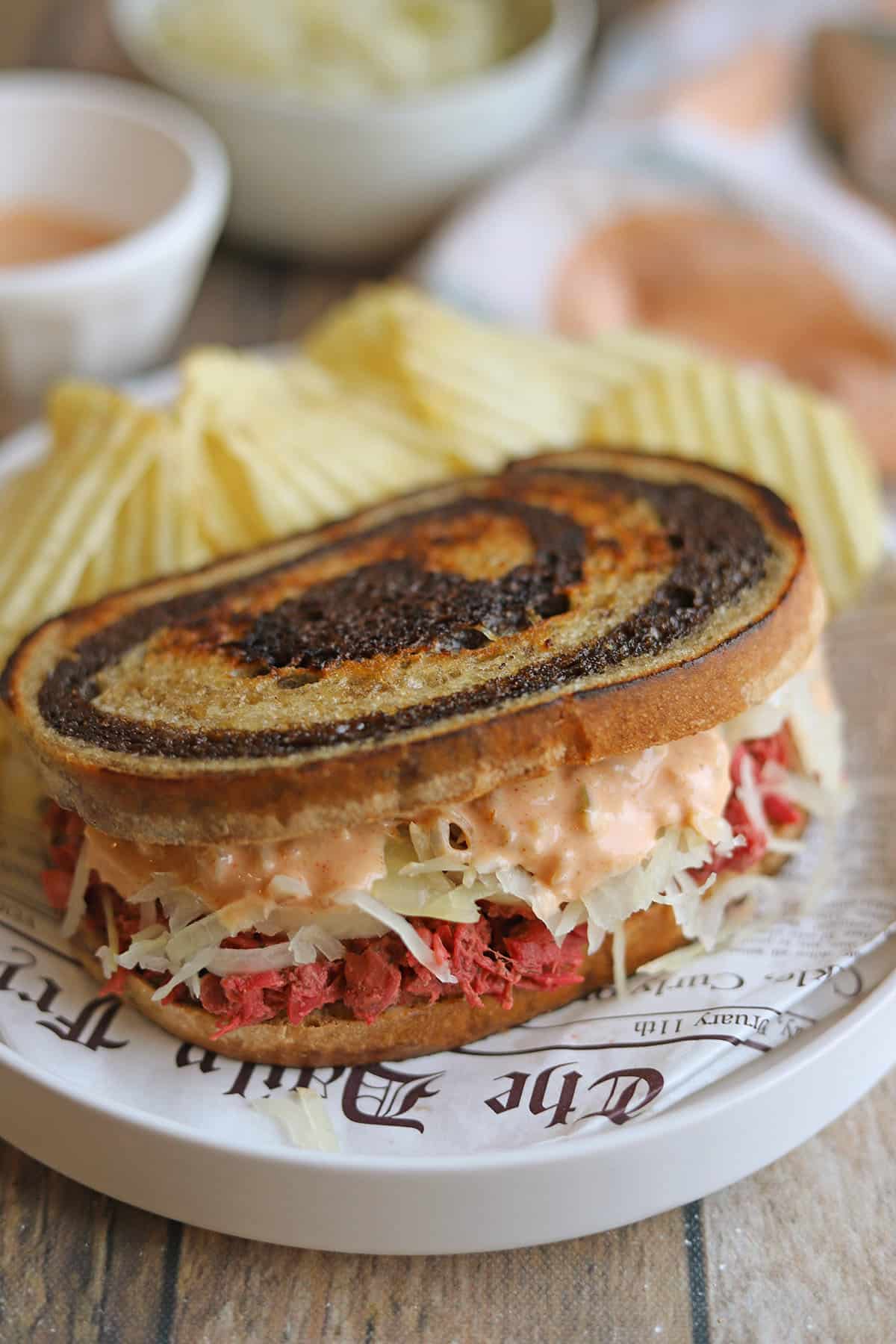 Vegan jackfruit reuben filled with corned beef-style jackfruit, sauerkraut, and Thousand Island dressing.