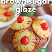 Text overlay: Pineapple brown sugar glaze, for vegan ham, cadryskitchen.com. Seitan ham glazed with pineapple brown sugar glaze, and topped with roasted pineapple rings and maraschino cherries.