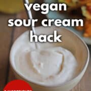 Text overlay: Trader Joe's vegan sour cream hack. 2 ingredients, 3 minutes, cadryskitchen.com. Light and airy vegan sour cream in bowl with spoon.