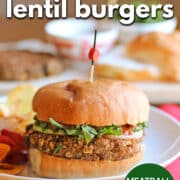 Protein-packed vegan lentil burgers on plate. Text overlay: Vegan lentil burgers, meatball flavored, cadryskitchen.com.