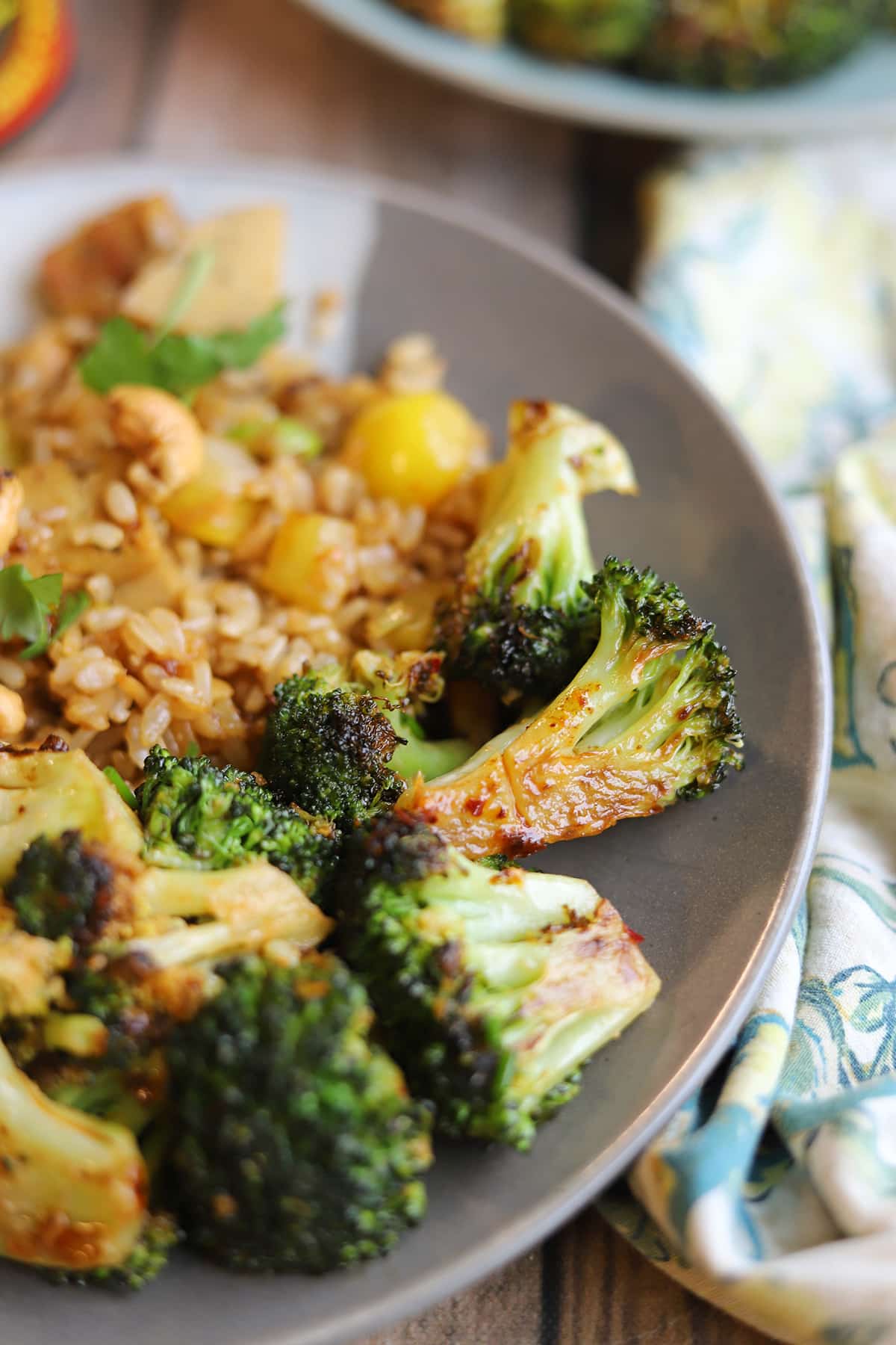 Chili crisp vegan mayo sauce clinging on oven roasted broccoli.