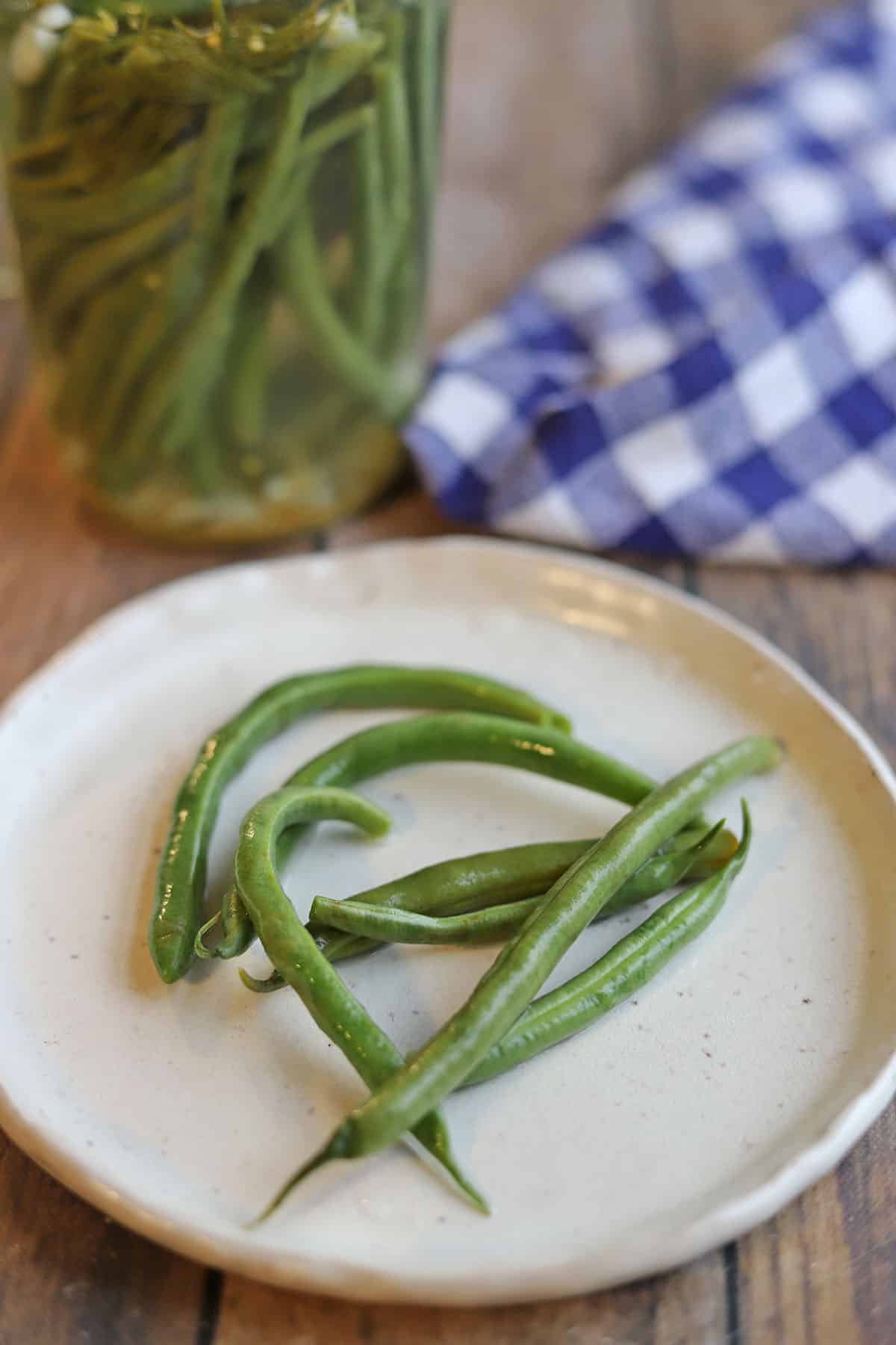Crunchy quick pickled green beans on plate.