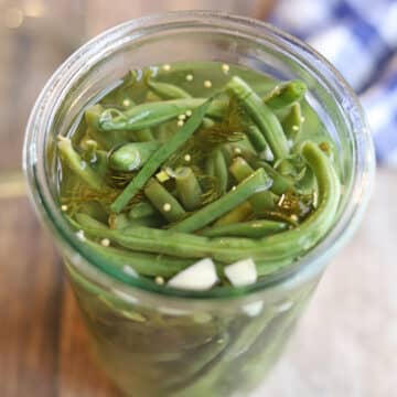 Dilly green beans with garlic in jar.