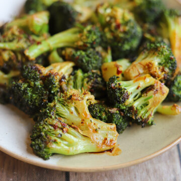 Oven-roasted broccoli coated in a garlicky chili crisp vegan mayo sauce.