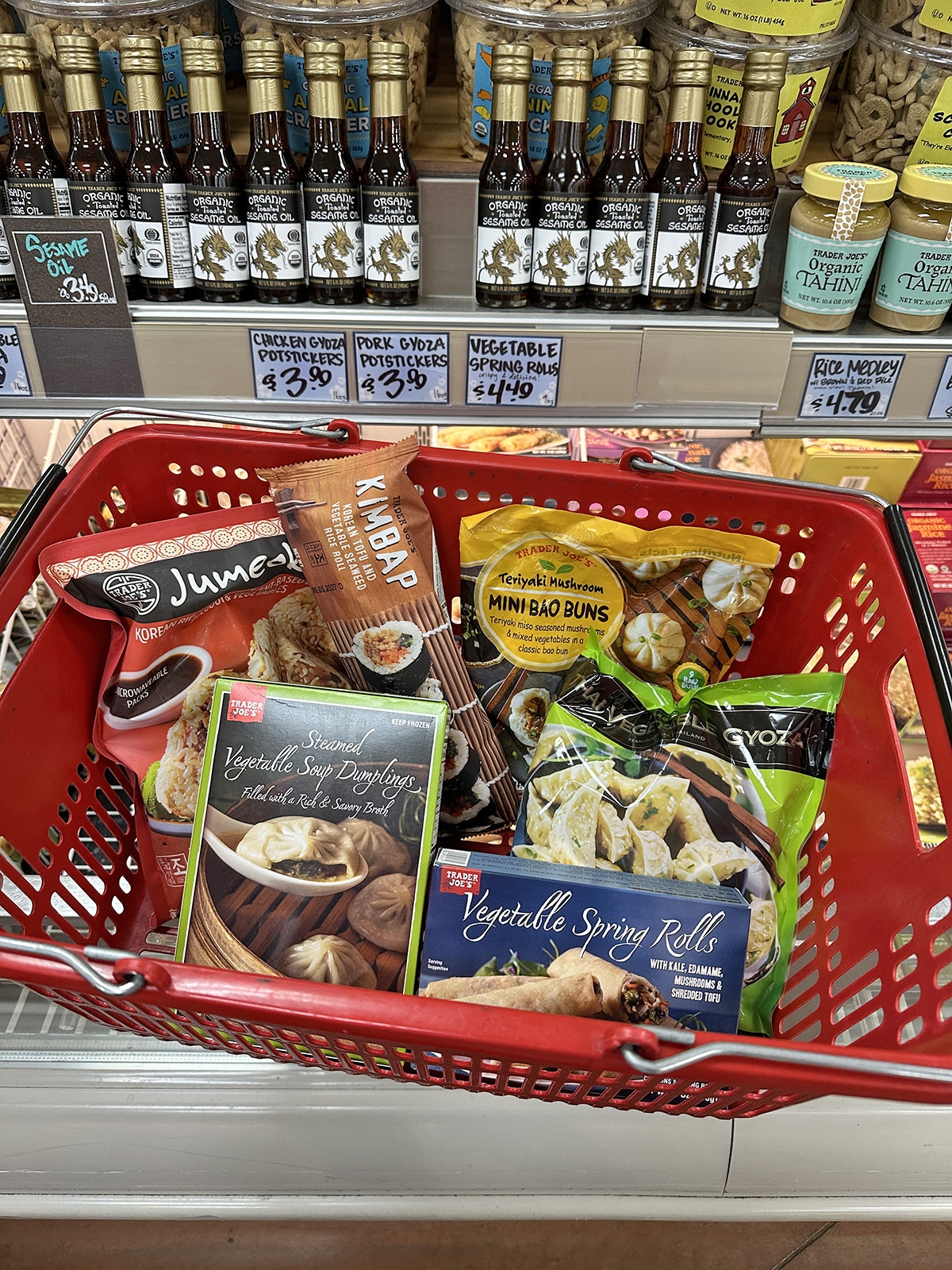 Frozen Asian appetizers from Trader Joe's in shopping basket.