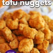 Text overlay: Air fryer tofu nuggets, vegan popcorn tofu, cadryskitchen.com. Platter of golden tofu nuggets with crunchy, gluten-free breading.