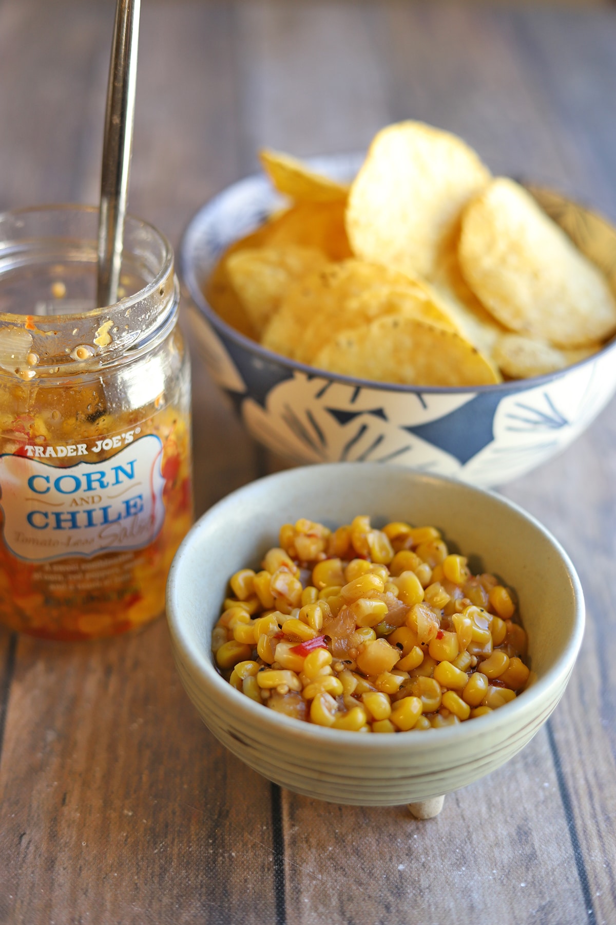 Bowl of corn and chile tomato-less salsa with tortilla chips.