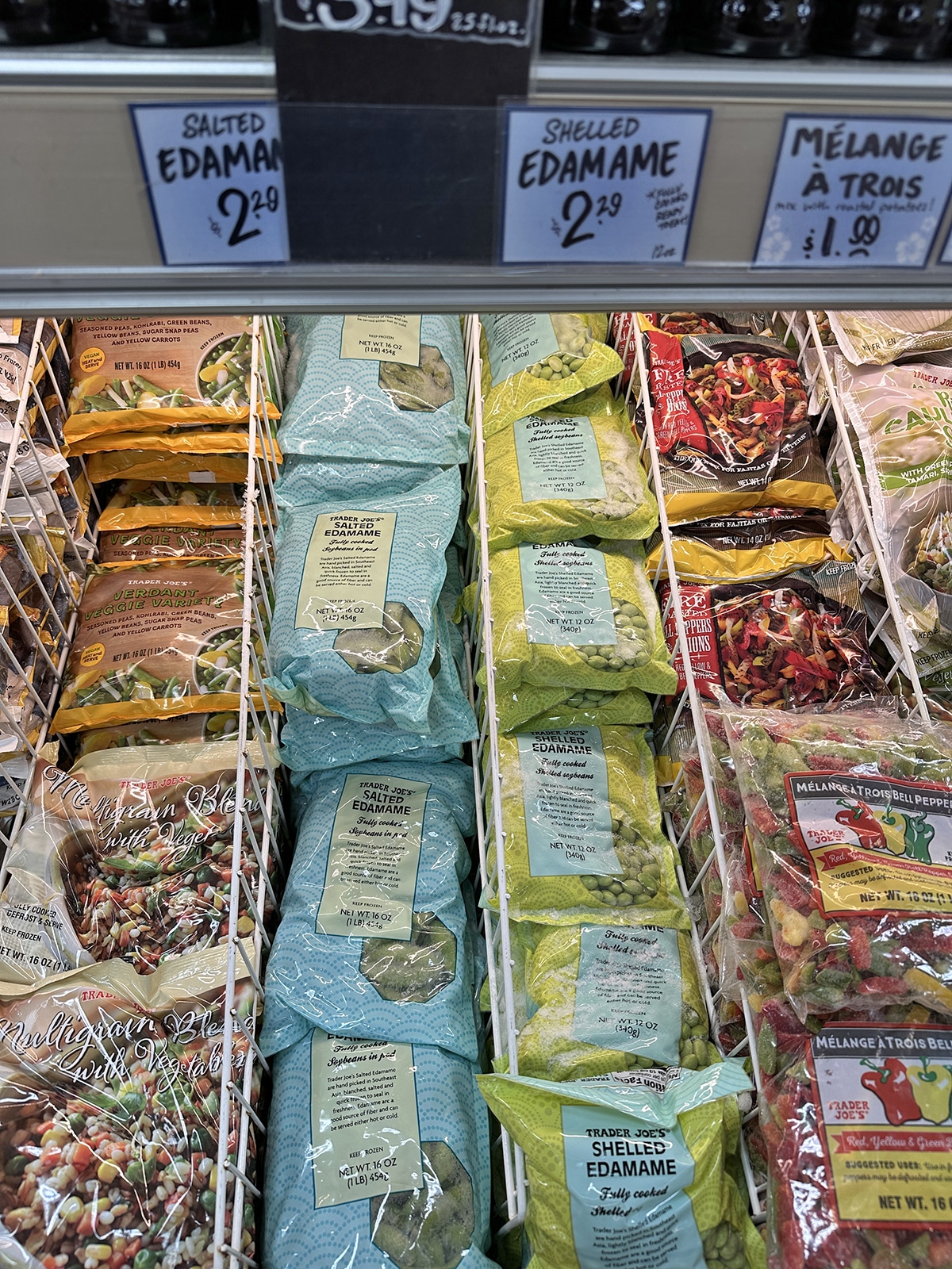 Salted edamame in pods and shelled in frozen case at Trader Joe's.