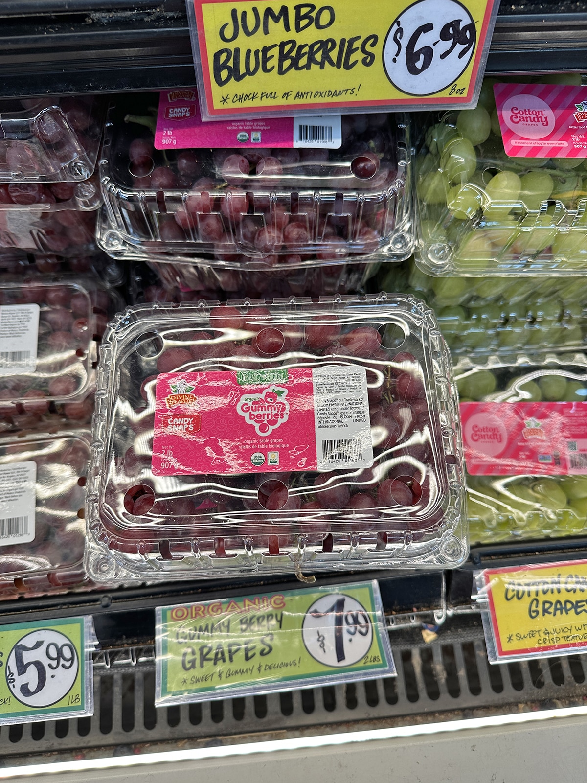 Gummy berry grapes on display in refrigerated case at Trader Joe's.