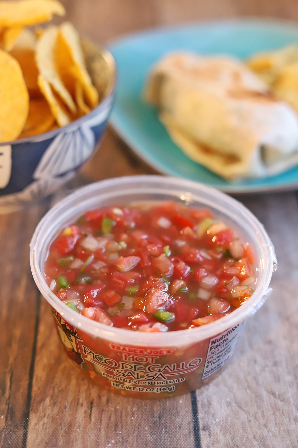 Hot pico de gallo salsa with burrito and tortilla chips.