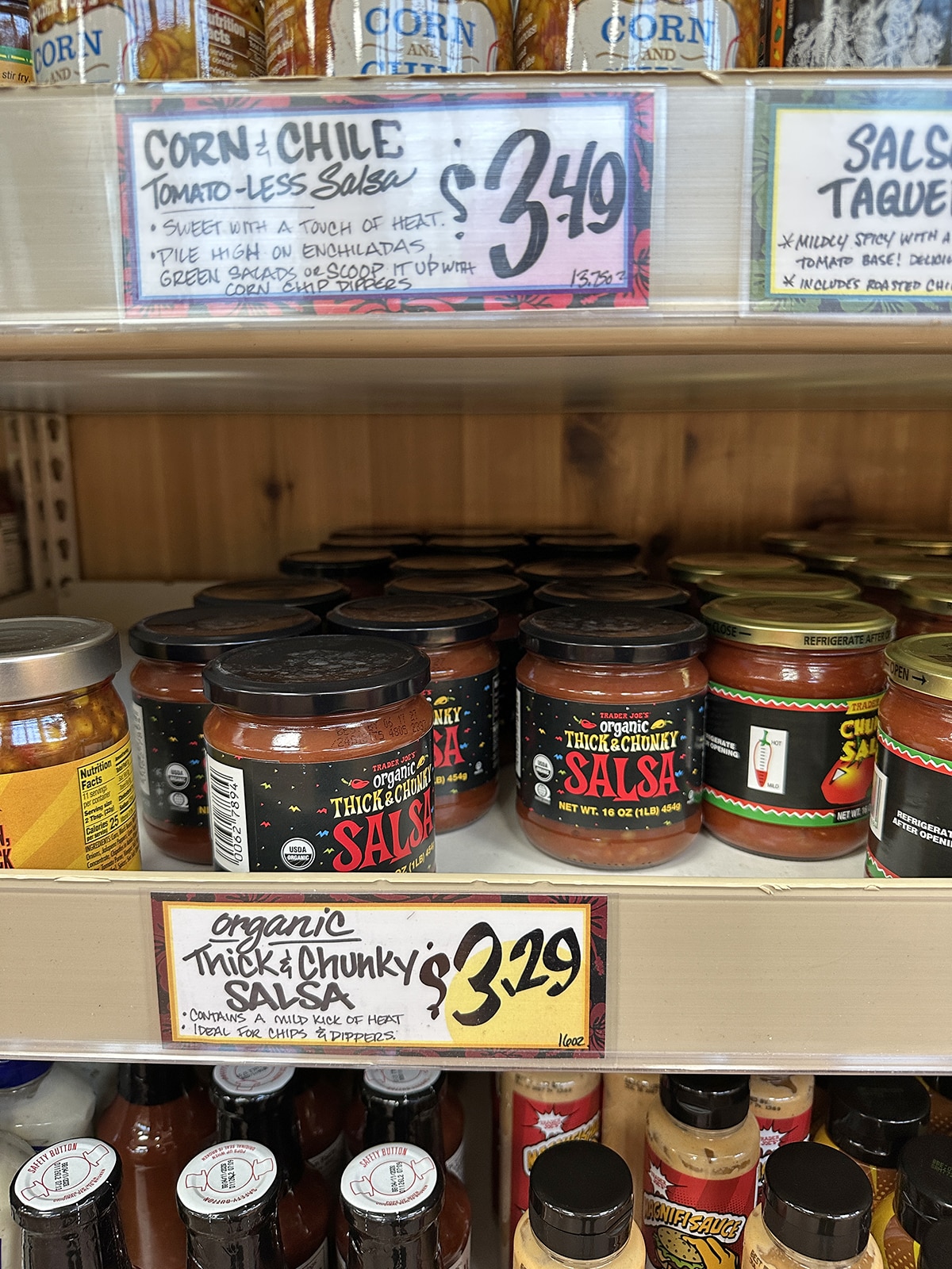 Jars of organic thick and chunky salsa on display at Trader Joe's grocery store.