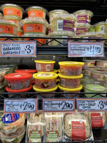 Hot and mild pico de gallo, plus mango pineapple pico de gallo salsa in refrigerated case at Trader Joe's.