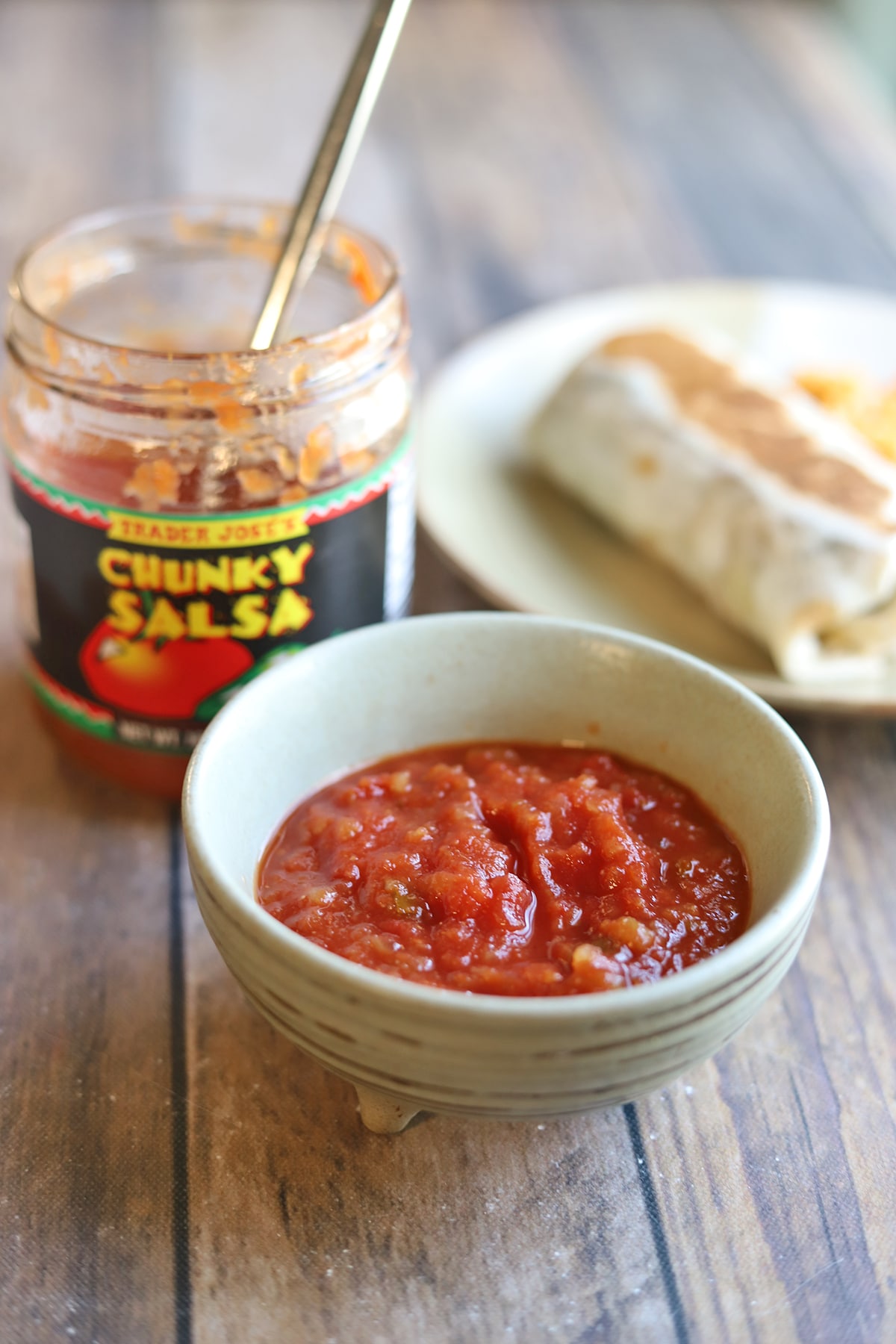 Jar of Trader Joe's chunky salsa by burrito.
