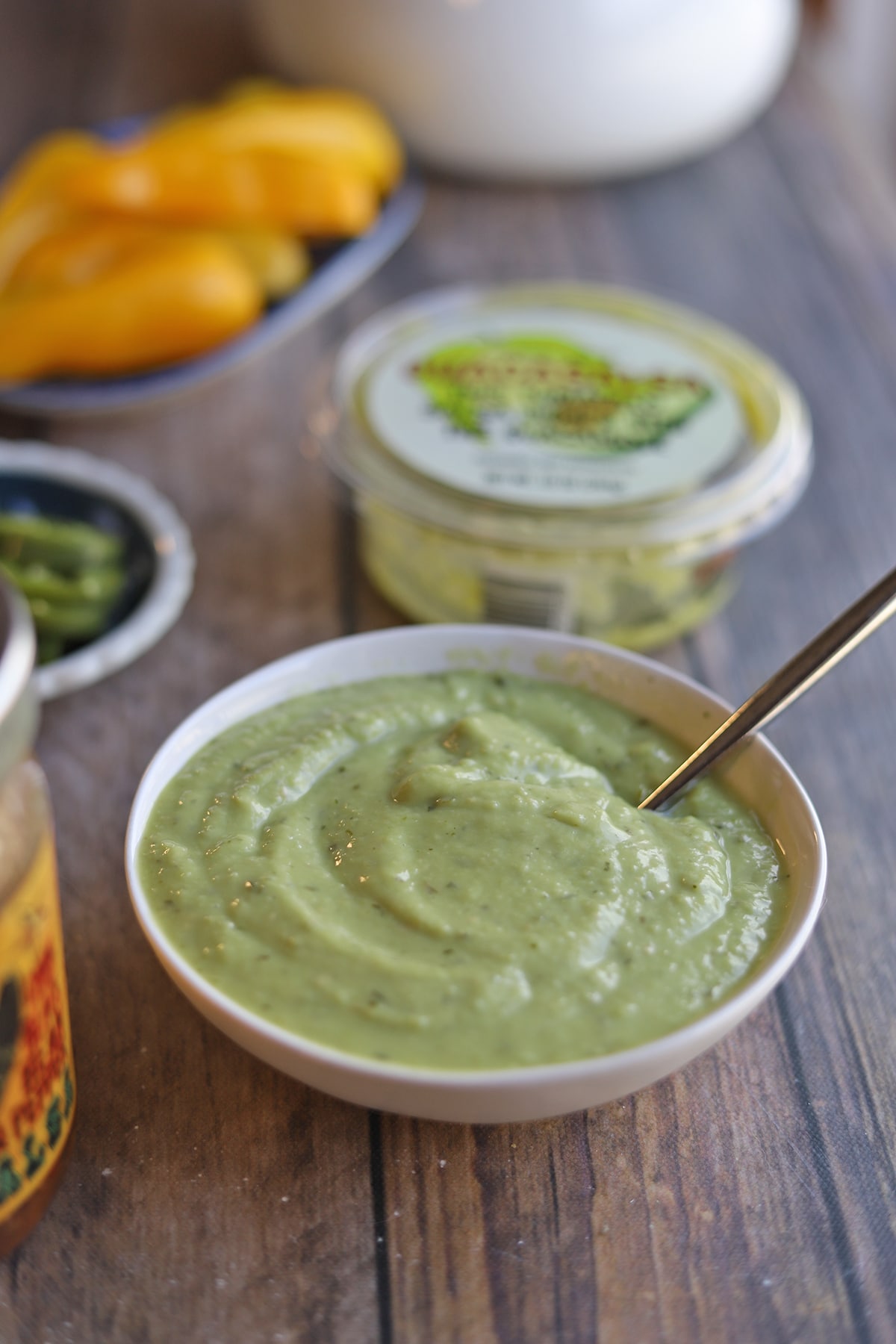 Trader Joe's guacasalsa in bowl with spoon.