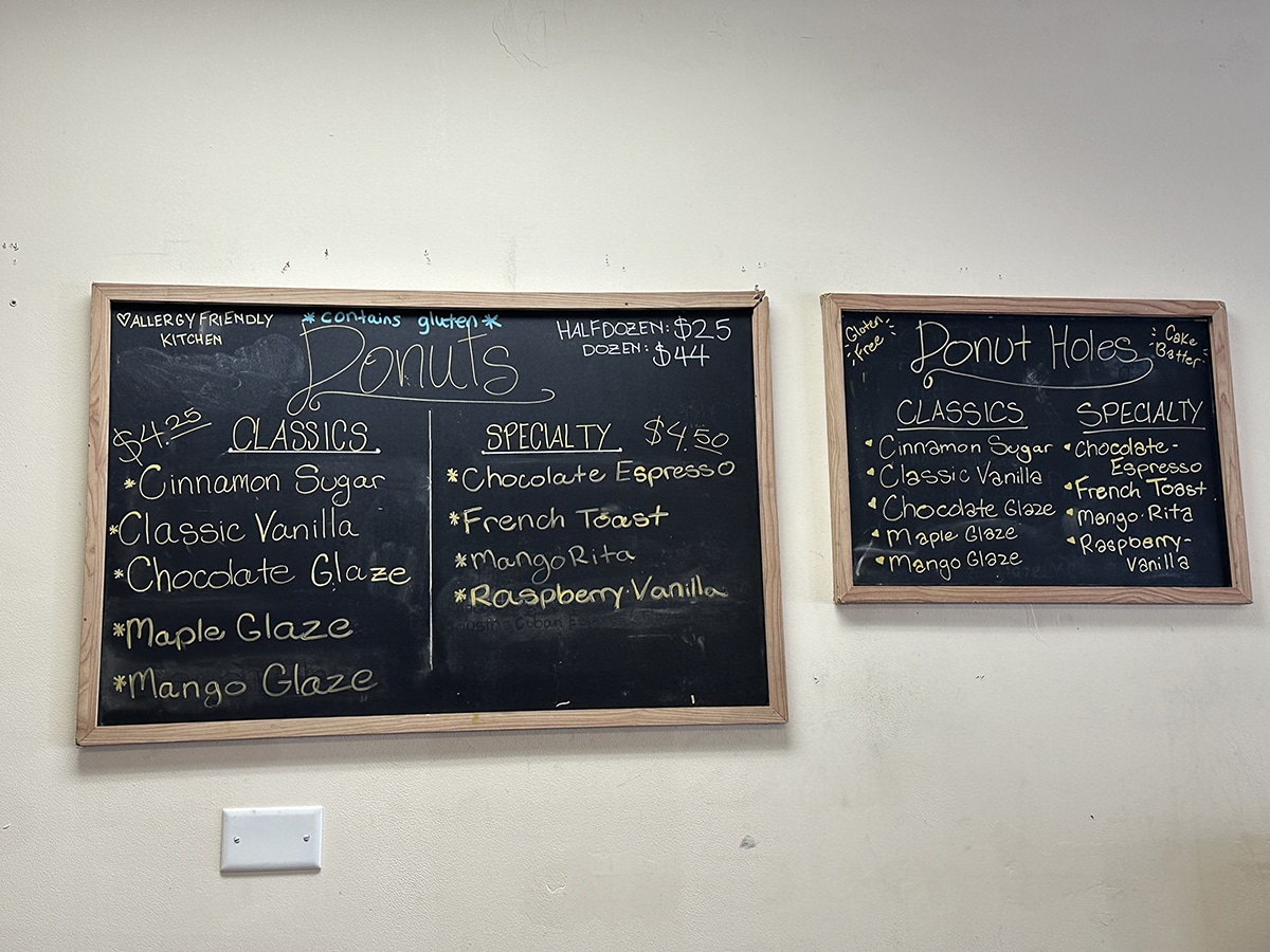 Chalkboard menu for vegan donuts and gluten-free donut holes.