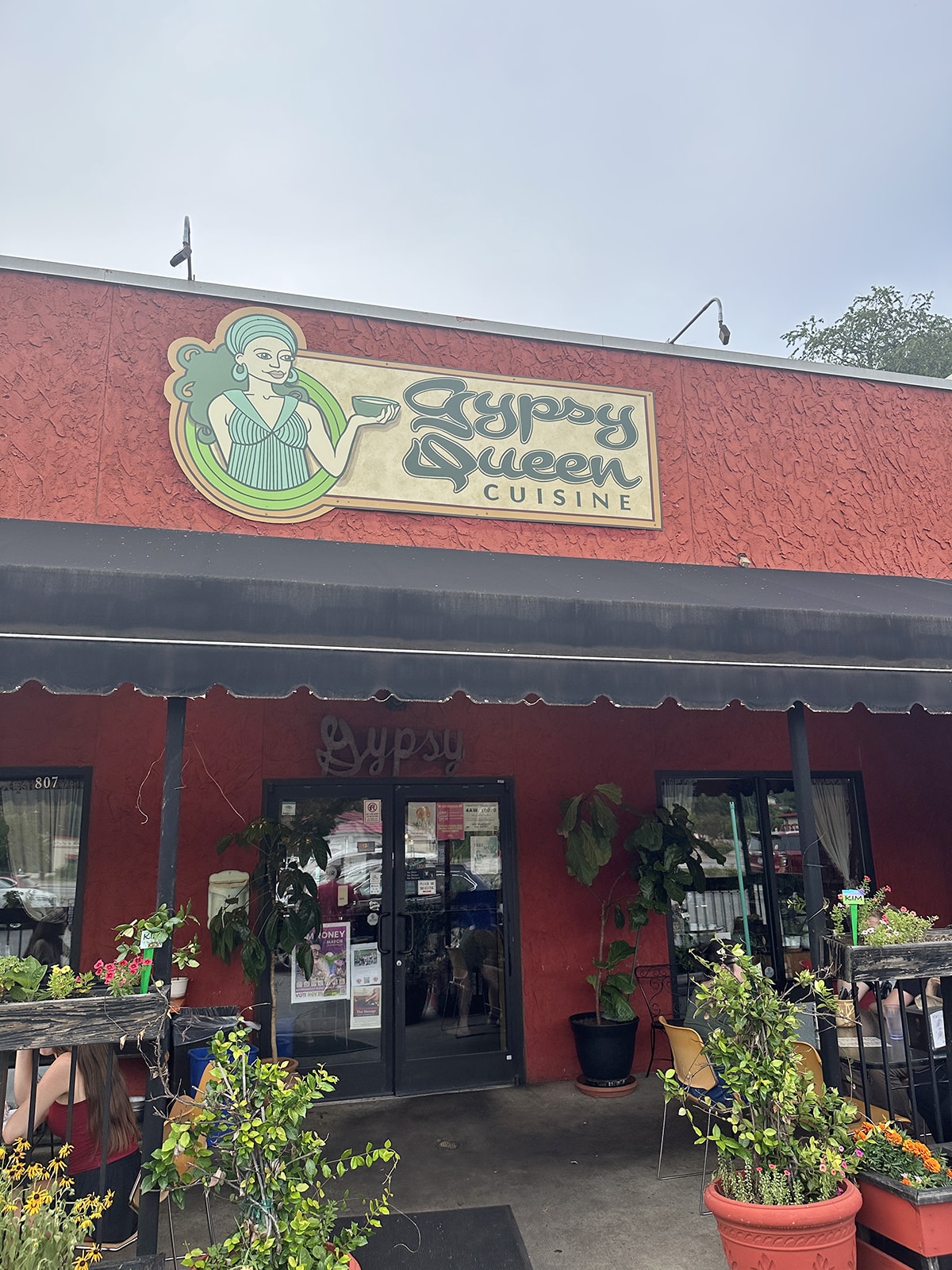 Exterior Gypsy Queen Cuisine iwith patio dining.