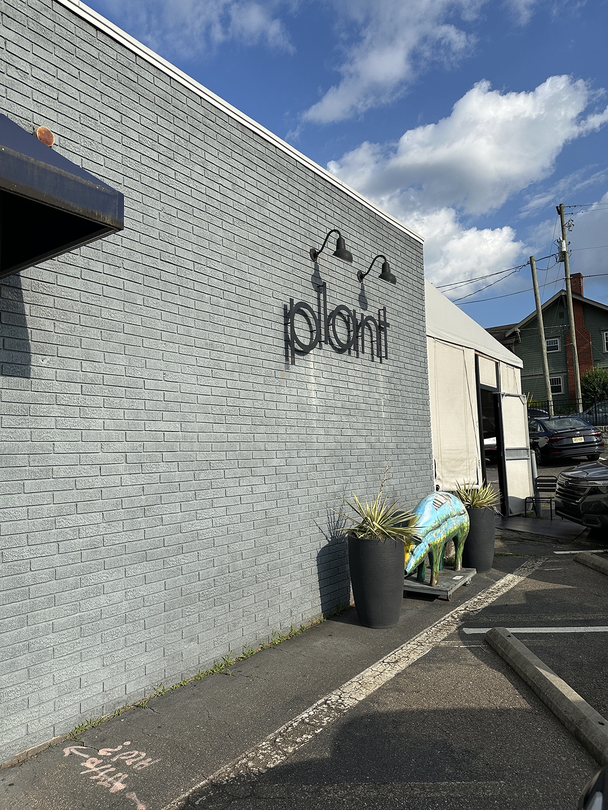 Exterior Plant, a gray brick building in Asheville, North Carolina.