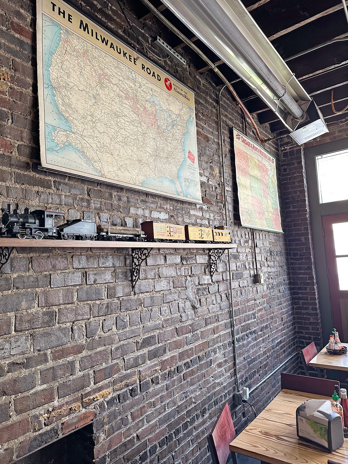 Railroad maps and model train on display at Railroad Bill's Dining Car in Des Moines, Iowa.
