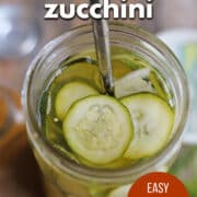 Text overlay: Quick pickled zucchini, easy refrigerator pickles, cadryskitchen.com. Sliced zucchini in simple brine.