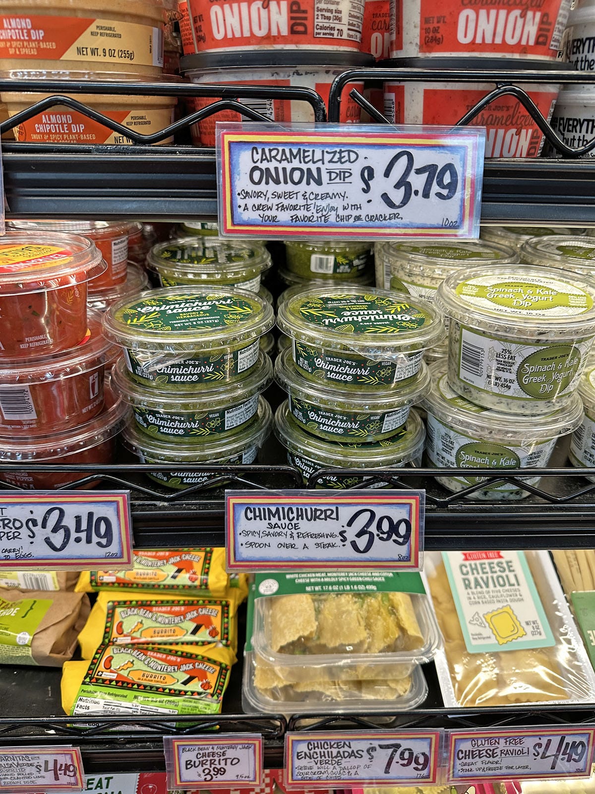 Containers of chimichurri in refrigerated case at Trader Joe's.