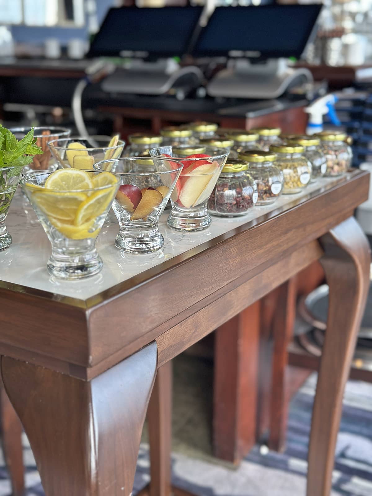 Loose teas and garnishes on table.