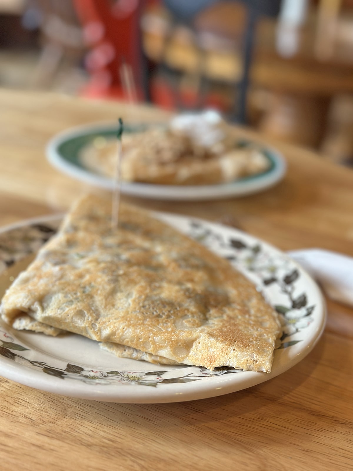 Savory crepe stuffed with tofu scramble.