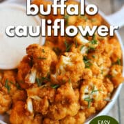 Text overlay: Air fryer buffalo cauliflower, easy vegan appetizer, cadryskitchen.com. Buffalo cauliflower wings on plate with vegan dipping sauce.